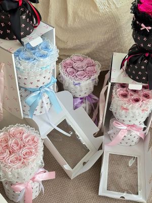 Romantic preserved rose bouquet in playful round wrapping style