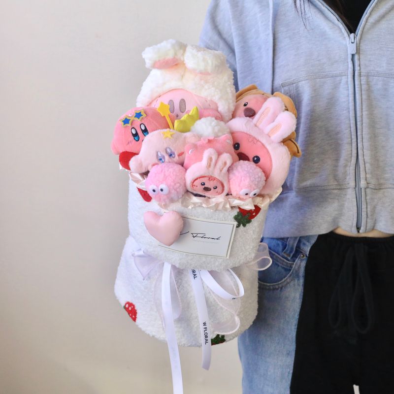 Kirby and Loopy plush bouquet held for size comparison