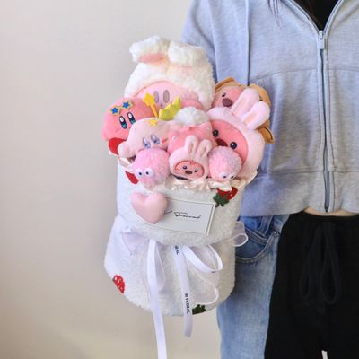 Kirby and Loopy plush bouquet held for size comparison