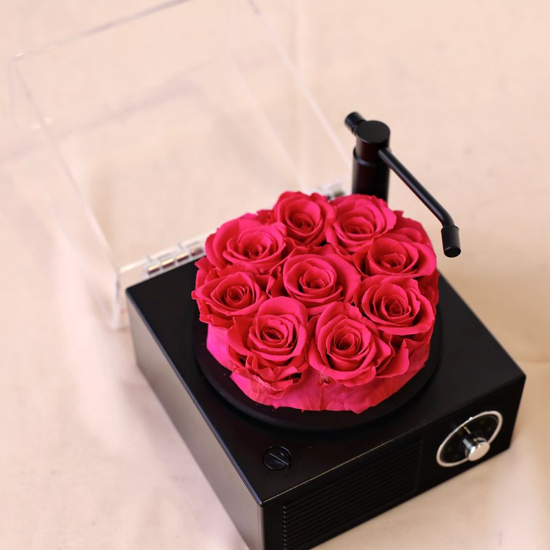 Mini Melody Bloom Bluetooth Speaker with vibrant pink preserved flowers