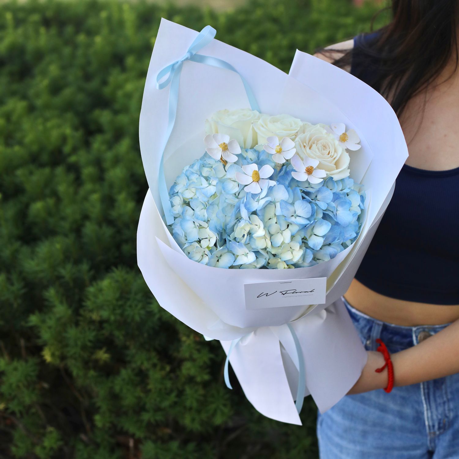 Blue hydrangea and white rose bouquet by W Floral Studio