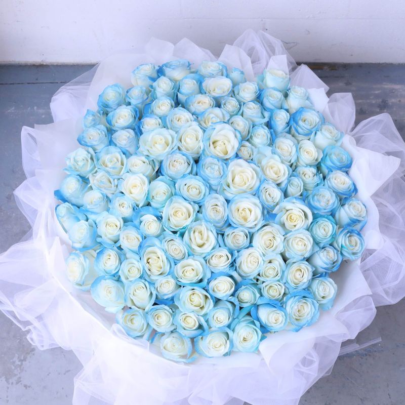 Elegant hand spray-tinted blue rose bouquet in a full grand style