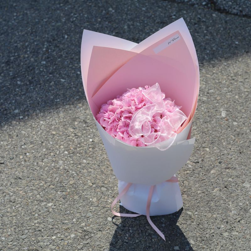 Pink hydrangea bouquet with modern wrapping