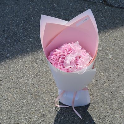 Pink hydrangea bouquet with modern wrapping