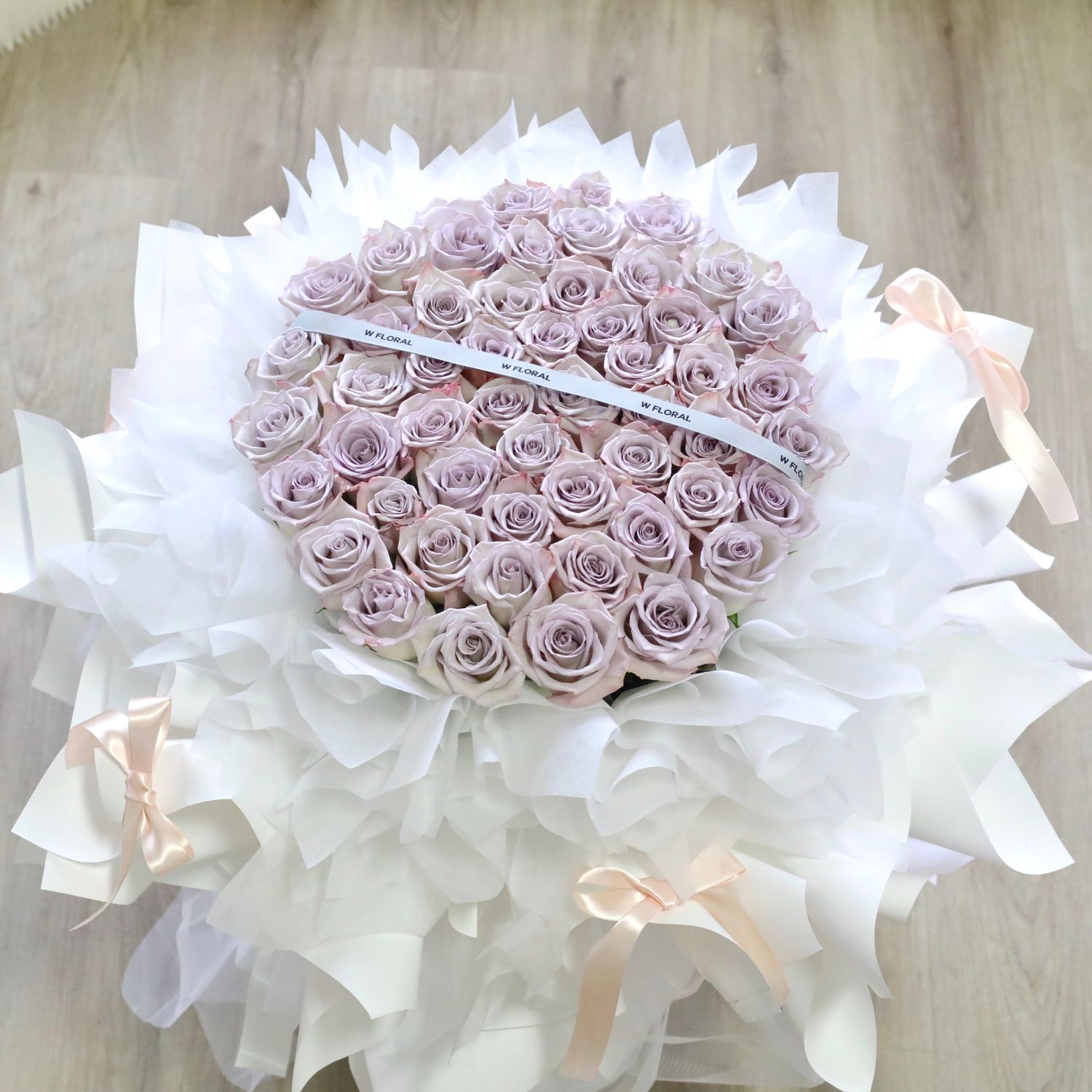 Grand luxury lavender rose round bouquet with soft ballet-style ribbon bows