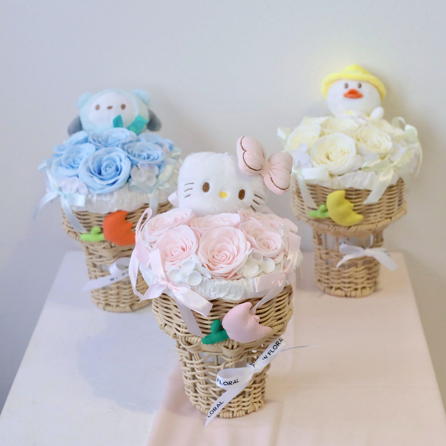 Pink Hello Kitty soap flower bouquet in ice cream basket gift arrangement