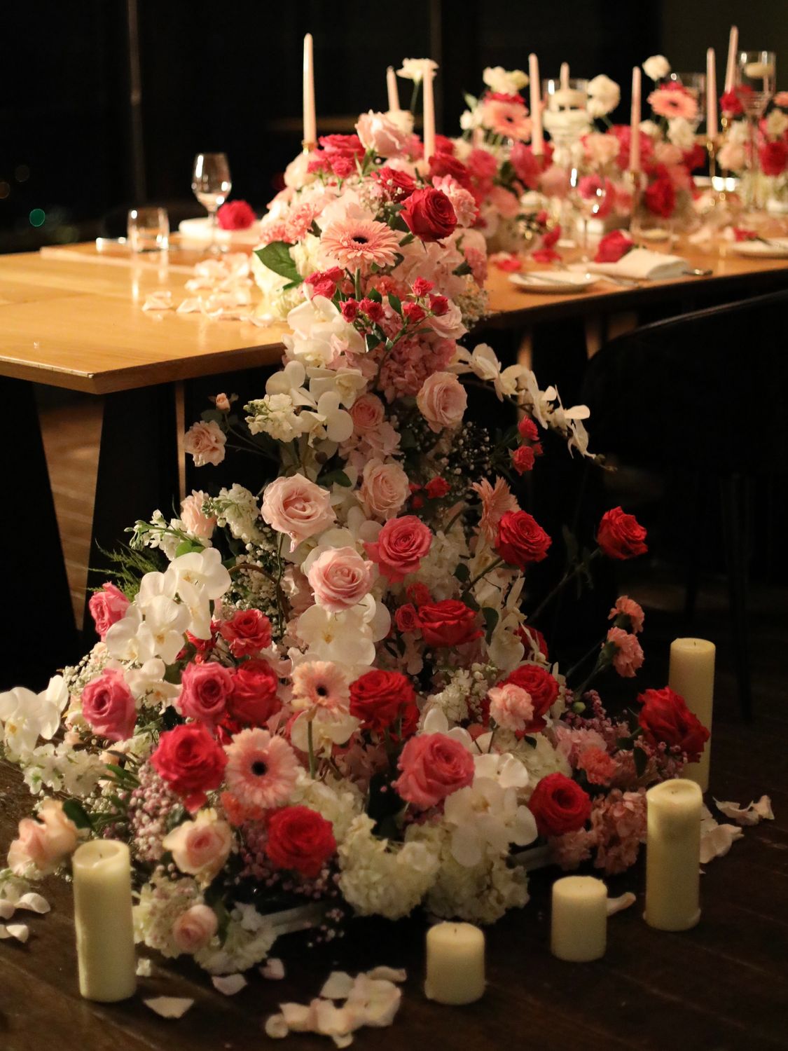 Pink birthday dinner table flowers and candle styling