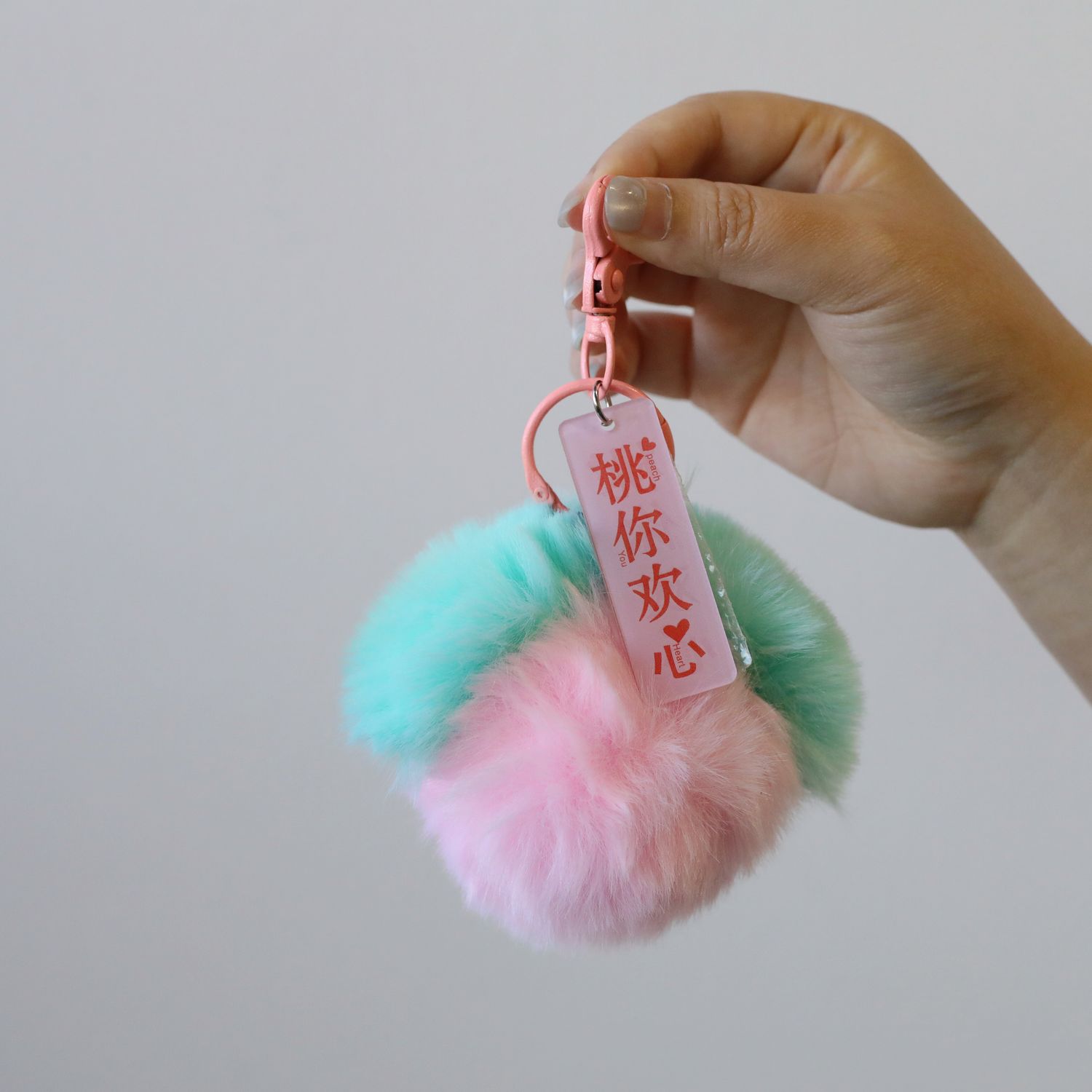 Pastel pink mint and peach fluffy pom pom bag charm keychain