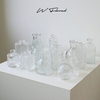 Small sculptural glass bud vase for single flower stems