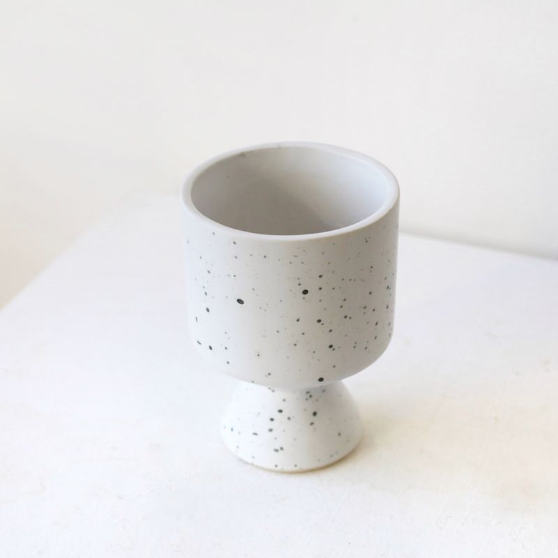 White ceramic flower vase with subtle speckled texture