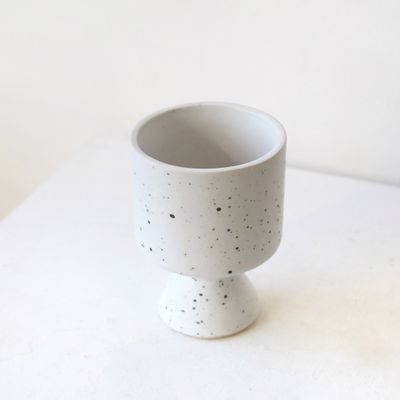 White ceramic flower vase with subtle speckled texture