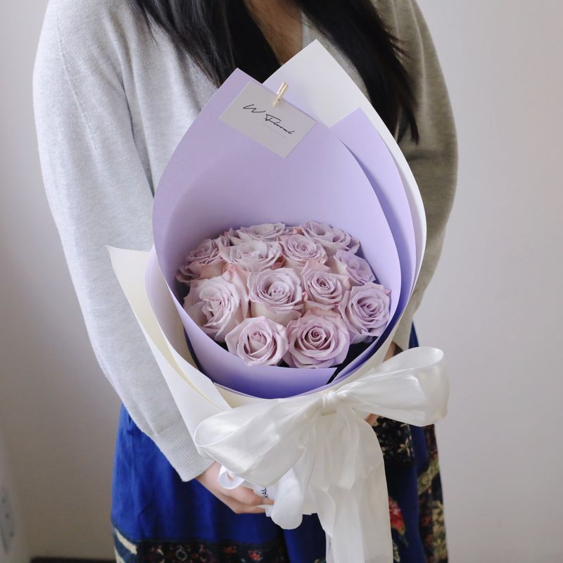 Silky Canelé lavender rose bouquet with elegant white ribbon bow