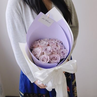 Silky Canelé lavender rose bouquet with elegant white ribbon bow