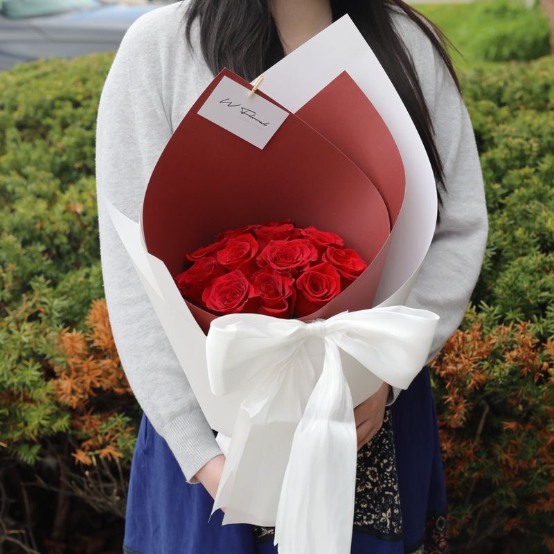 Silky Canelé red rose bouquet with elegant white ribbon bow