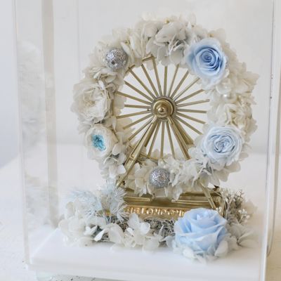 Light-up preserved flower arrangement in icy blue and white tones