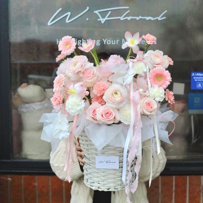 Pink garden-style flower basket arrangement with premium seasonal blooms by W Floral Studio Toronto