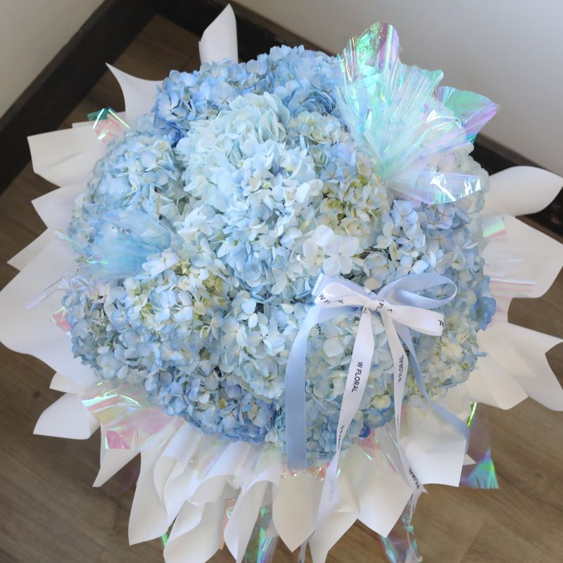 Luxury baby blue hydrangea bouquet with white wrapping
