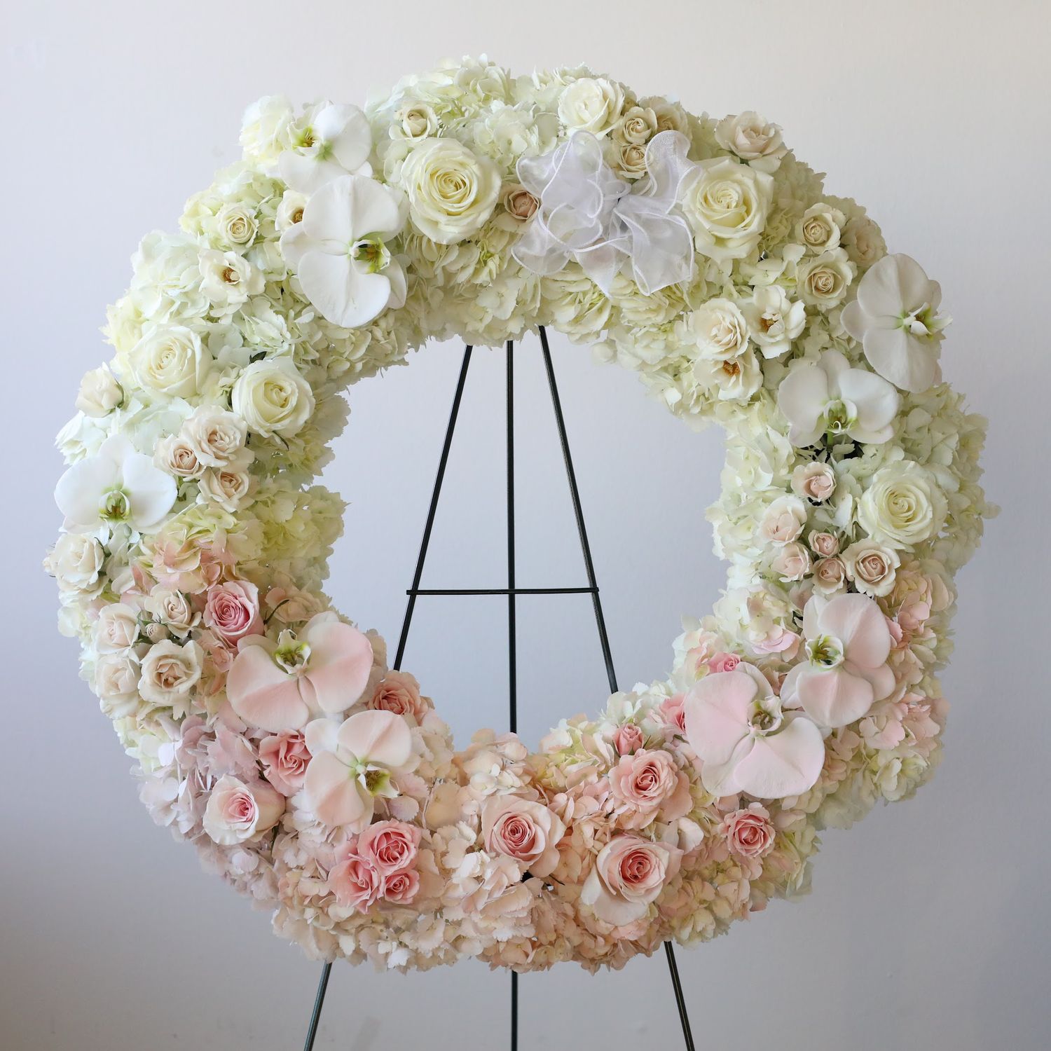Luxury ivory orchid hydrangea and rose sympathy wreath