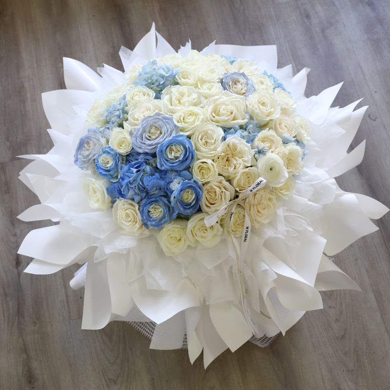 Blue hydrangea and rose bouquet by W Floral Studio