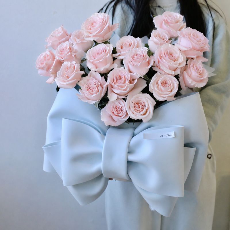 Pink rose hug bouquet with bow wrapping by W Floral Studio