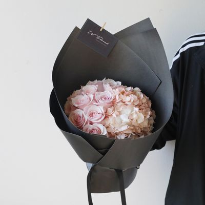 Blush noir hydrangea and rose bouquet with romantic moody tones