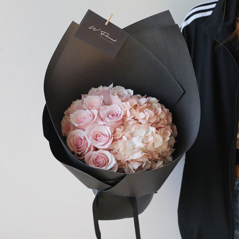 Hydrangea and rose bouquet in blush pink and dark accent colours