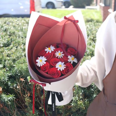 Romantic red rose and dried egg flower bouquet with modern wrapping by W Floral Studio.