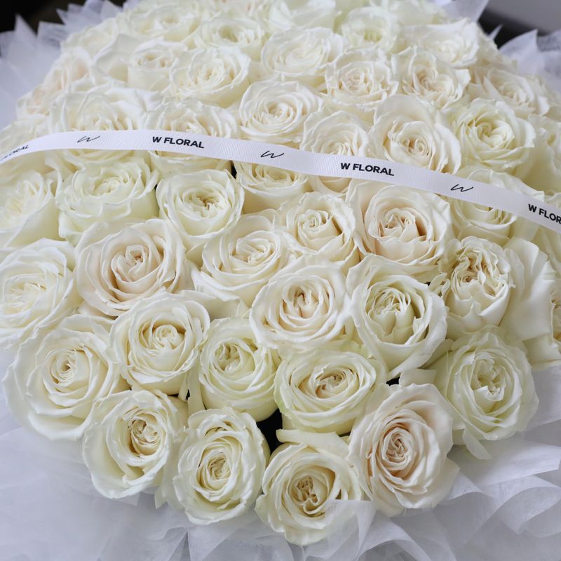 Grand and luxurious white rose round bouquet by W Floral Studio Toronto