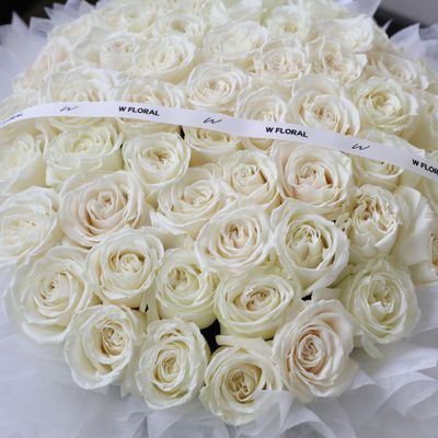 Grand and luxurious white rose round bouquet by W Floral Studio Toronto