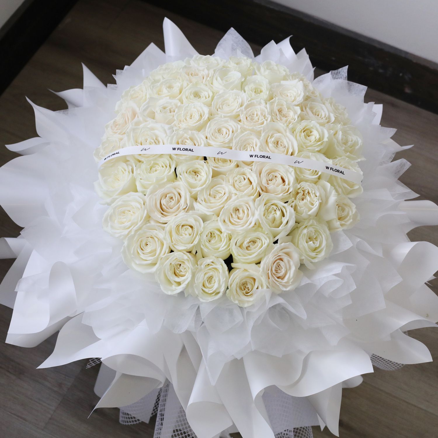 Grand and luxurious white rose round bouquet by W Floral Studio Toronto
