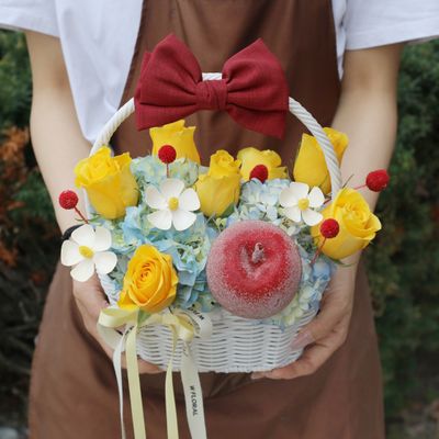 Cheerful fresh flower basket with yellow, blue, white and red floral accents