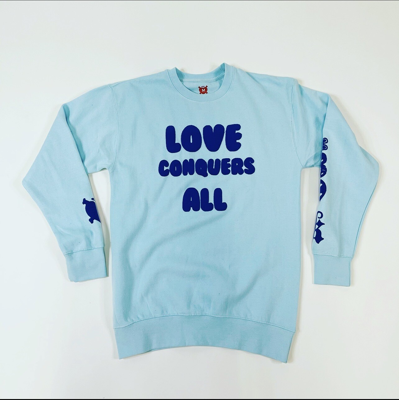 Light Blue & Navy Blue “Love Conquers All” Crewneck Sweater