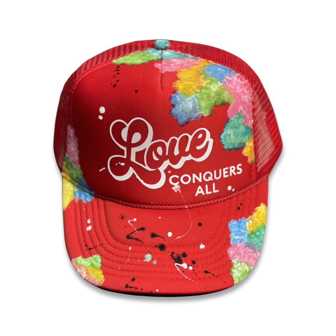 Red  “Love Conquers All” Trucker Hat