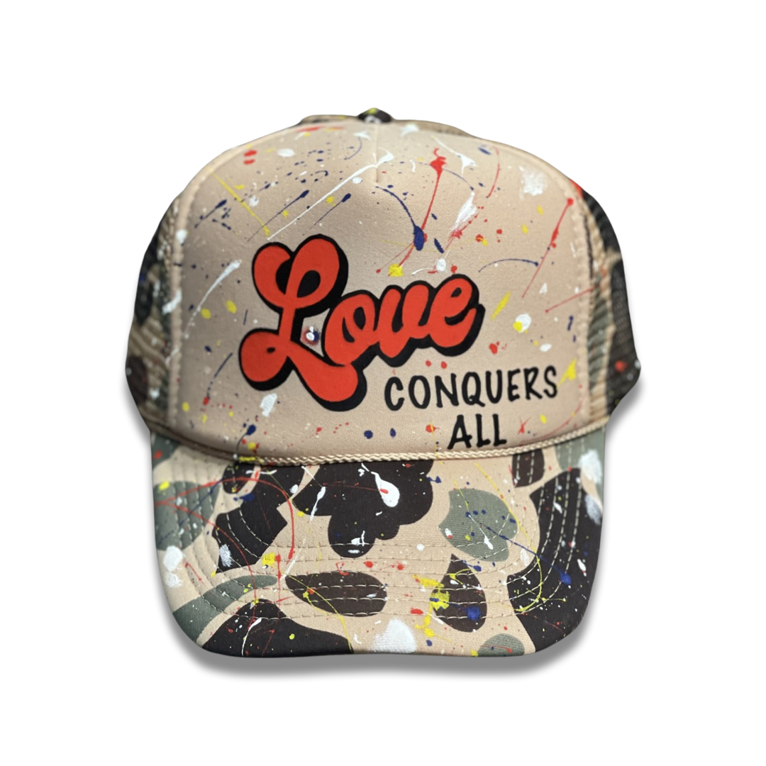Splatter Camo “Love Conquers All” Trucker Hat