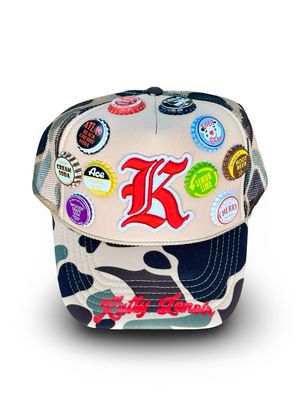 Camo Vintage “K” Bottle Cap Trucker Hat