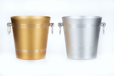 Tirolix ice bucket made of silver anodized aluminum with chrome knobs.