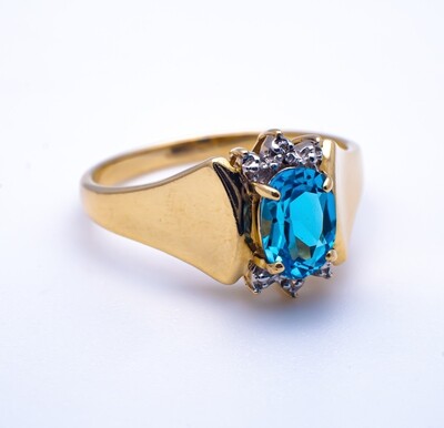 10k Gold Ring With Blue Stone and Diamonds. SIZE-7