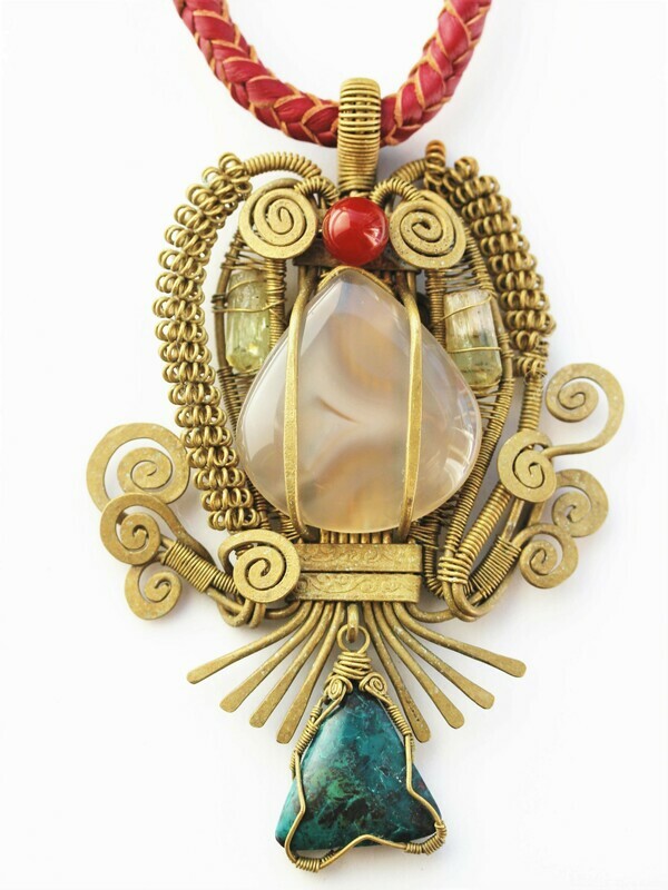 &quot;El Buho.&quot; This little owl has an agate belly, brass feathers, a cornelian beak and a chrysocolla tail.