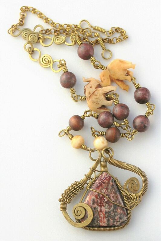 Brass and leopard jasper with rhodochrosite and bone elephants