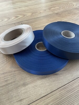 Rolls of custom fabric care labels for manufacturers