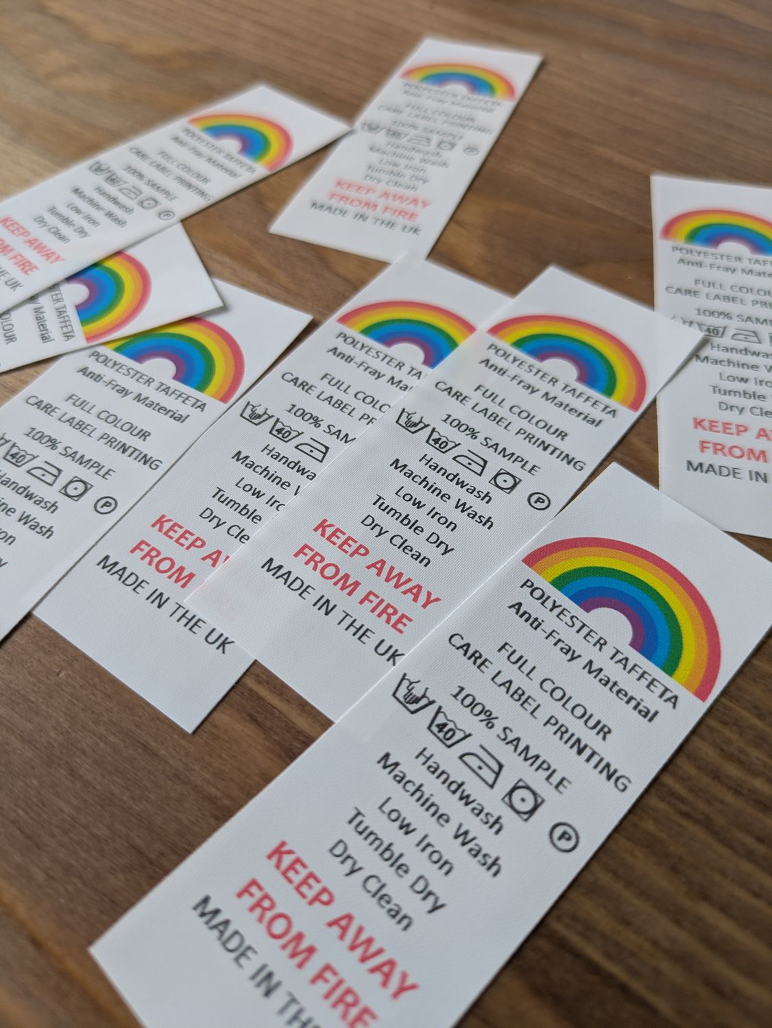 Custom polyester taffeta colour printed labels on roll for garment branding and care instructions