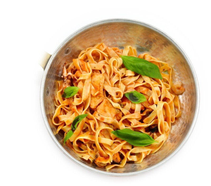 Pasta with fish in tomato and white whine sauce