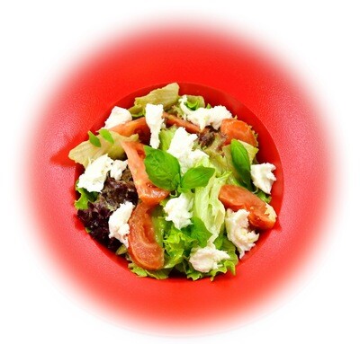 Salad with avocado pesto, Mozzarella cheese and tomatoes