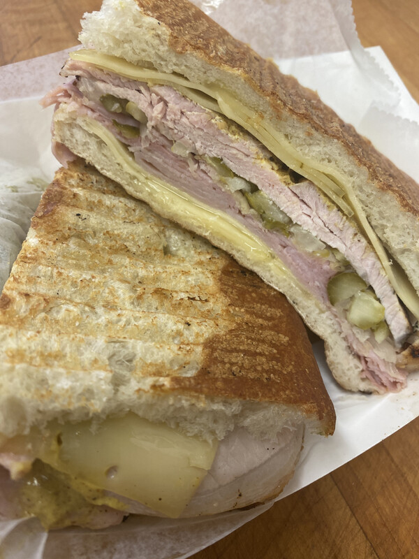 K- 
roast pork, swiss, ham, sauerkraut, mustard, pickles