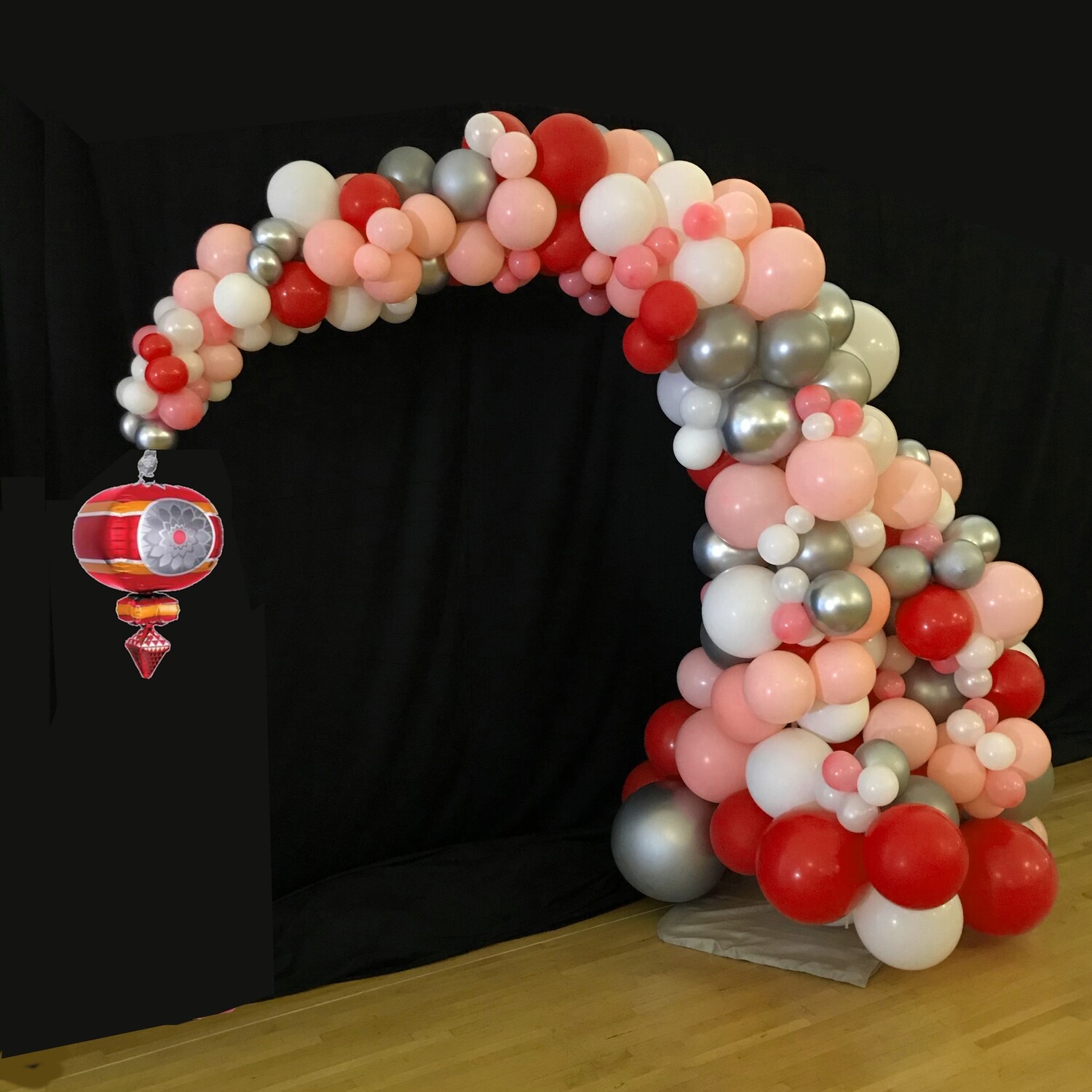 Demi balloon arch with holiday Ornament