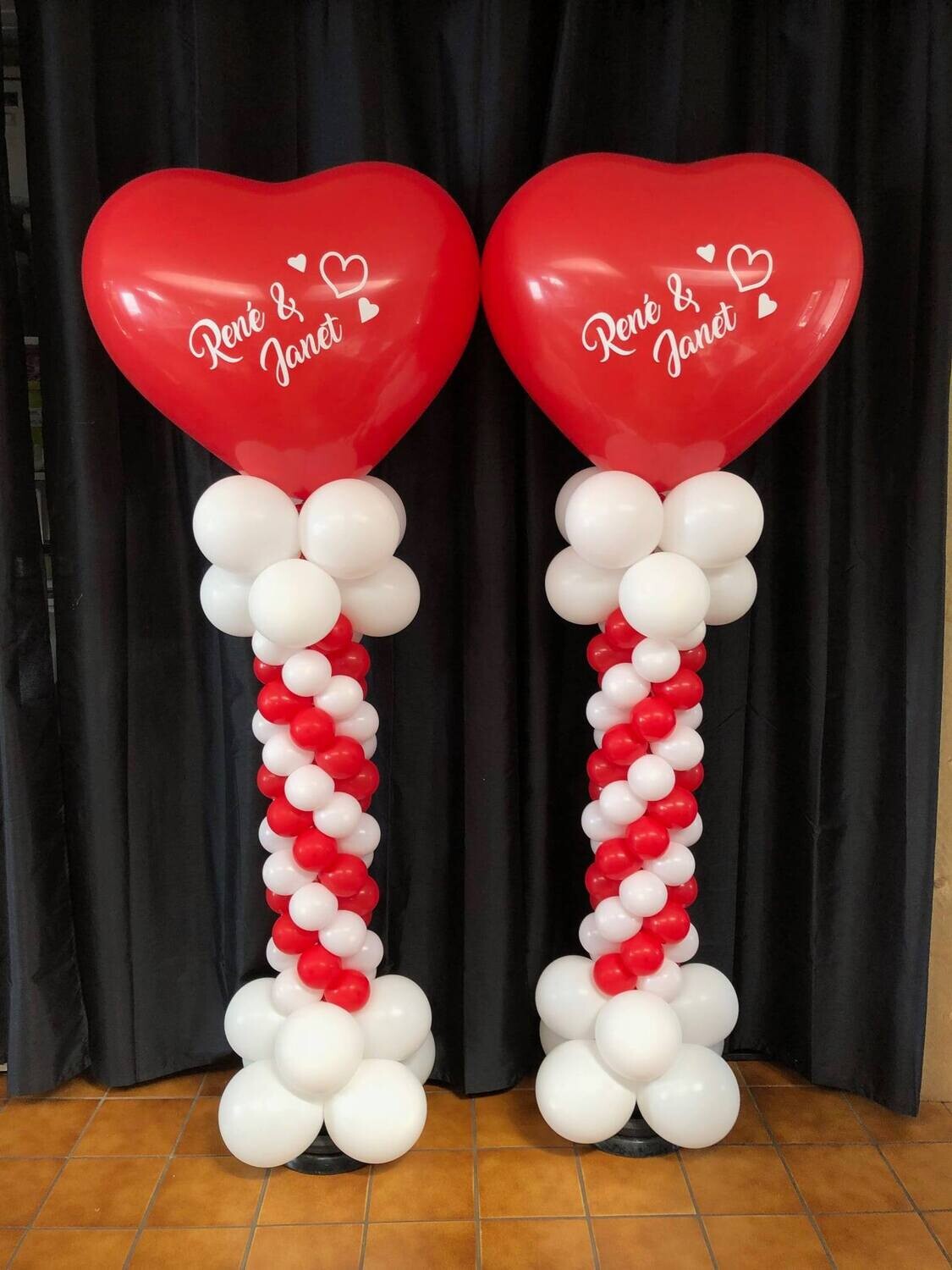 A custom printed balloon column with giant latex heart