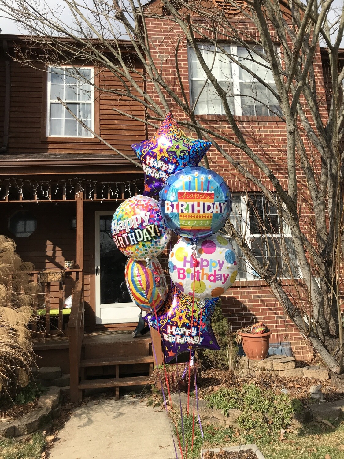 Six colorful birthday FOIL helium balloons (indoors)