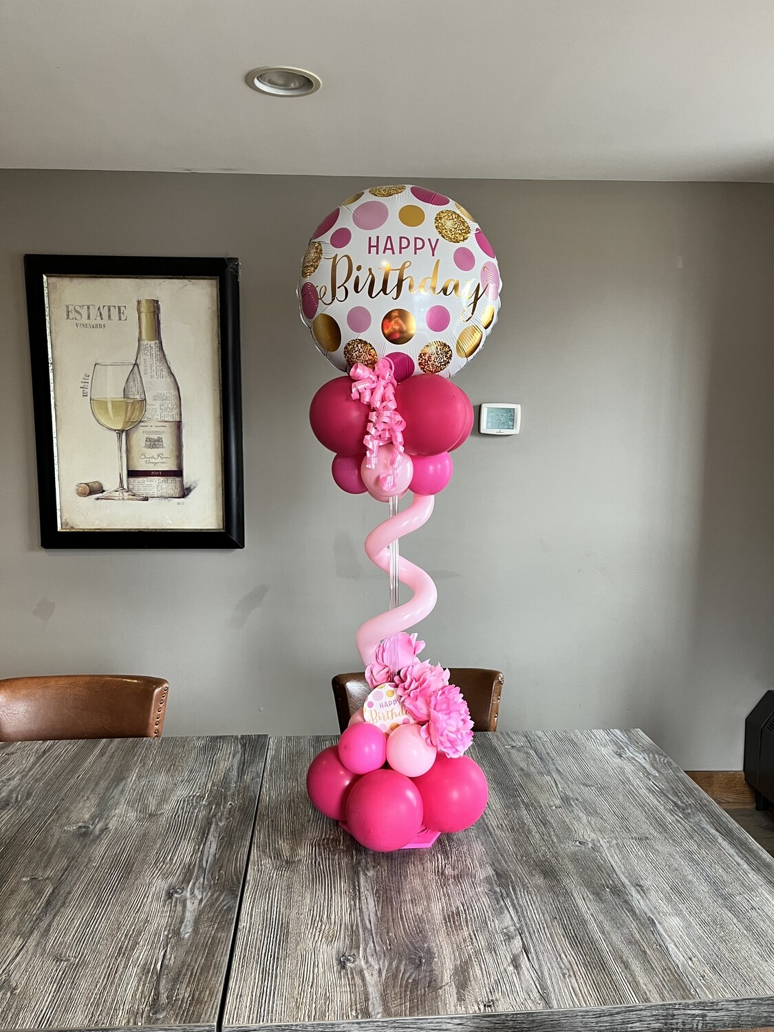 Foil topper balloon table center piece with florals, about 4 feet (indoors)
