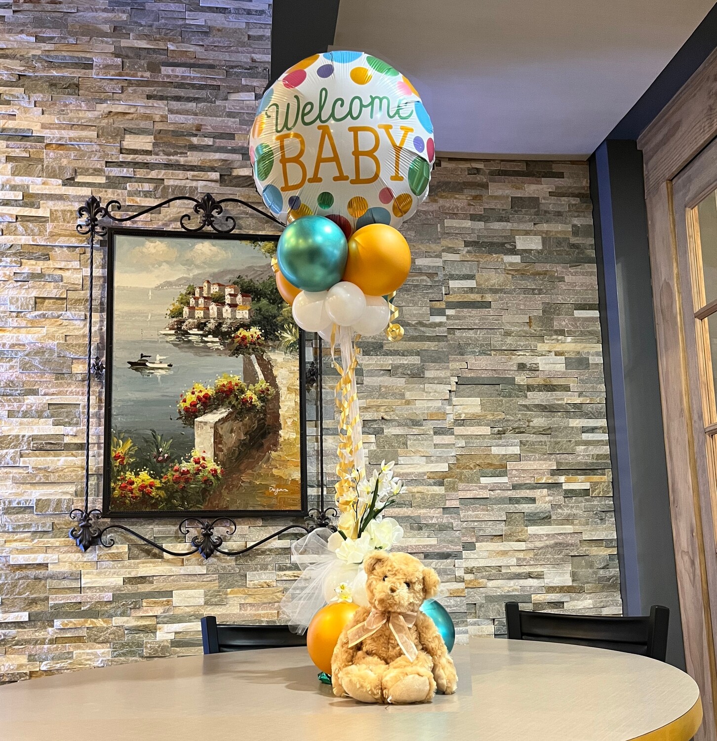 Welcome Baby balloon table center piece with florals, about 4 feet (indoors)