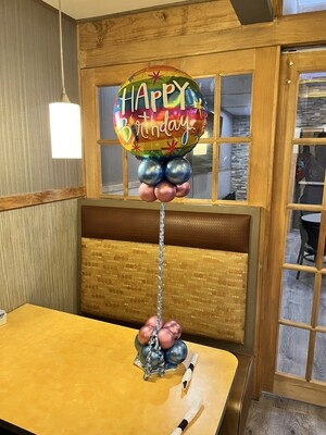 metallic stripey happy birthday balloon table center piece (no florals) about 4 feet (indoors)